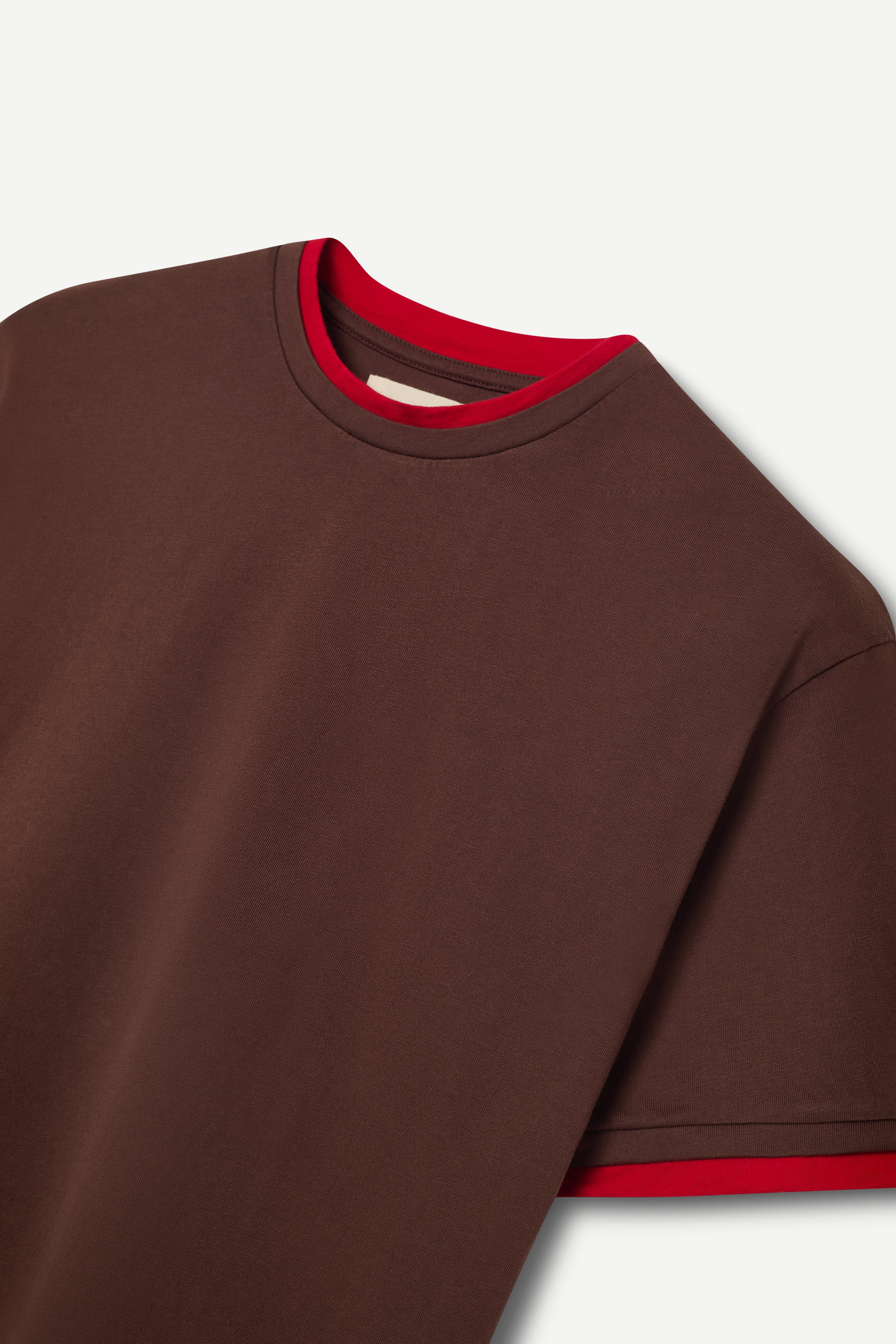 front view of a regular fit brown short-sleeved t-shirt with red double-layered neckline, sleeves and hem