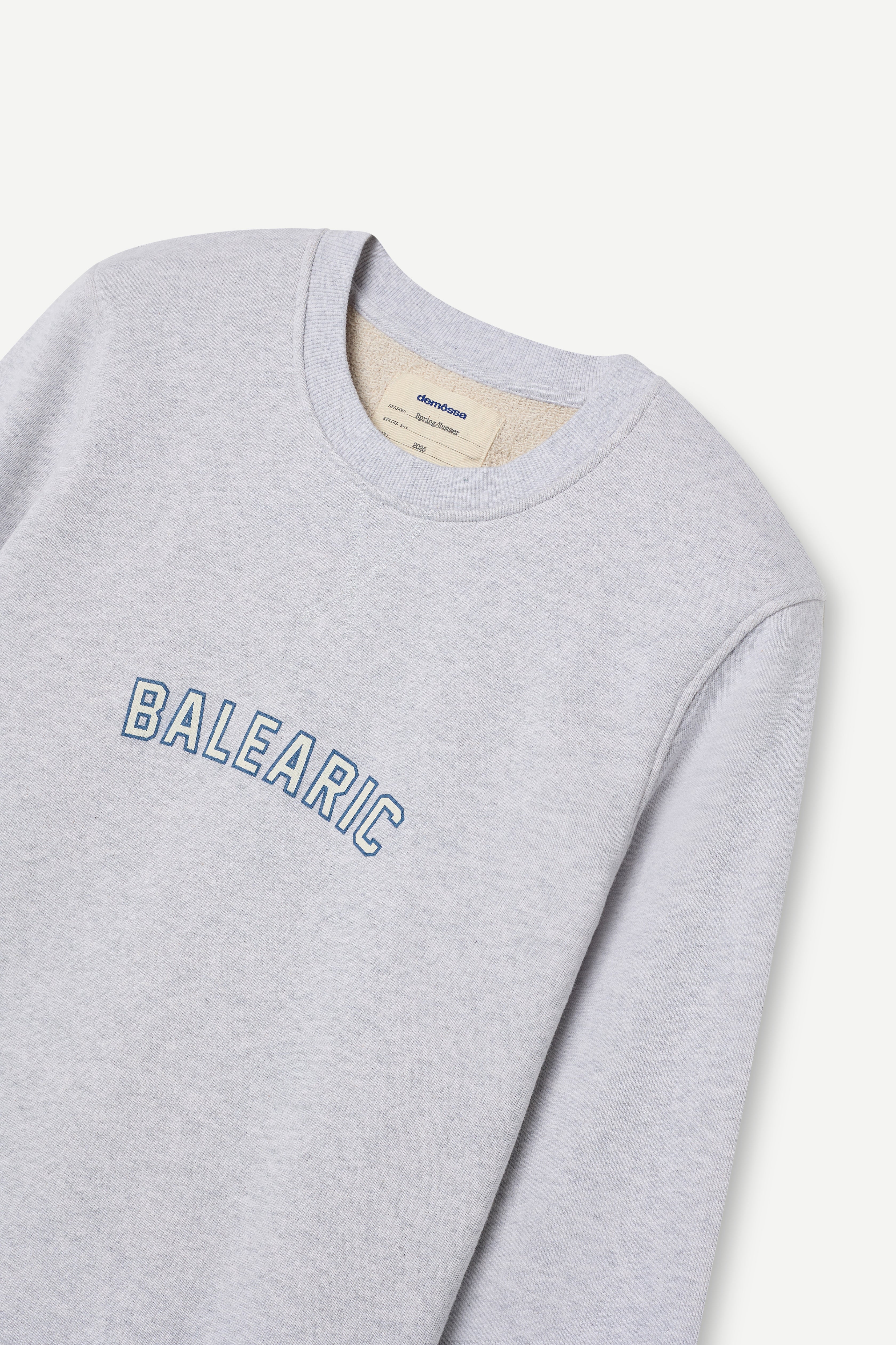 front view of a melange grey relaxed-fit sweatshirt with "Balearic" print on the chest