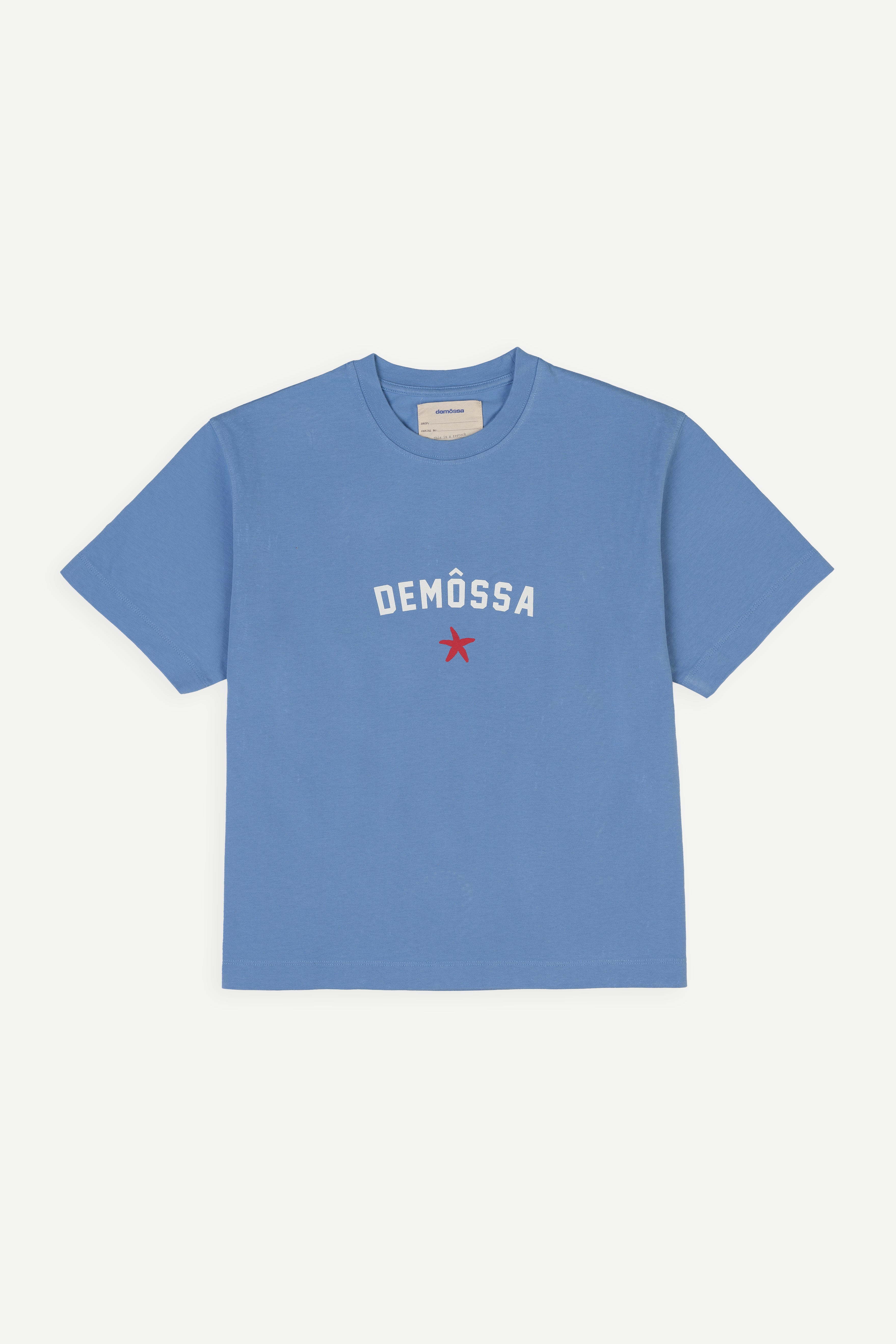Blue t-shirt with 'DEMOSSA' branding on a white background