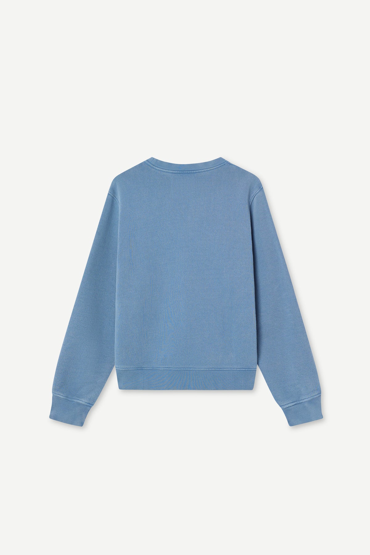A light blue long-sleeve crewneck sweatshirt shown from the back, laid flat against a clean off-white background.