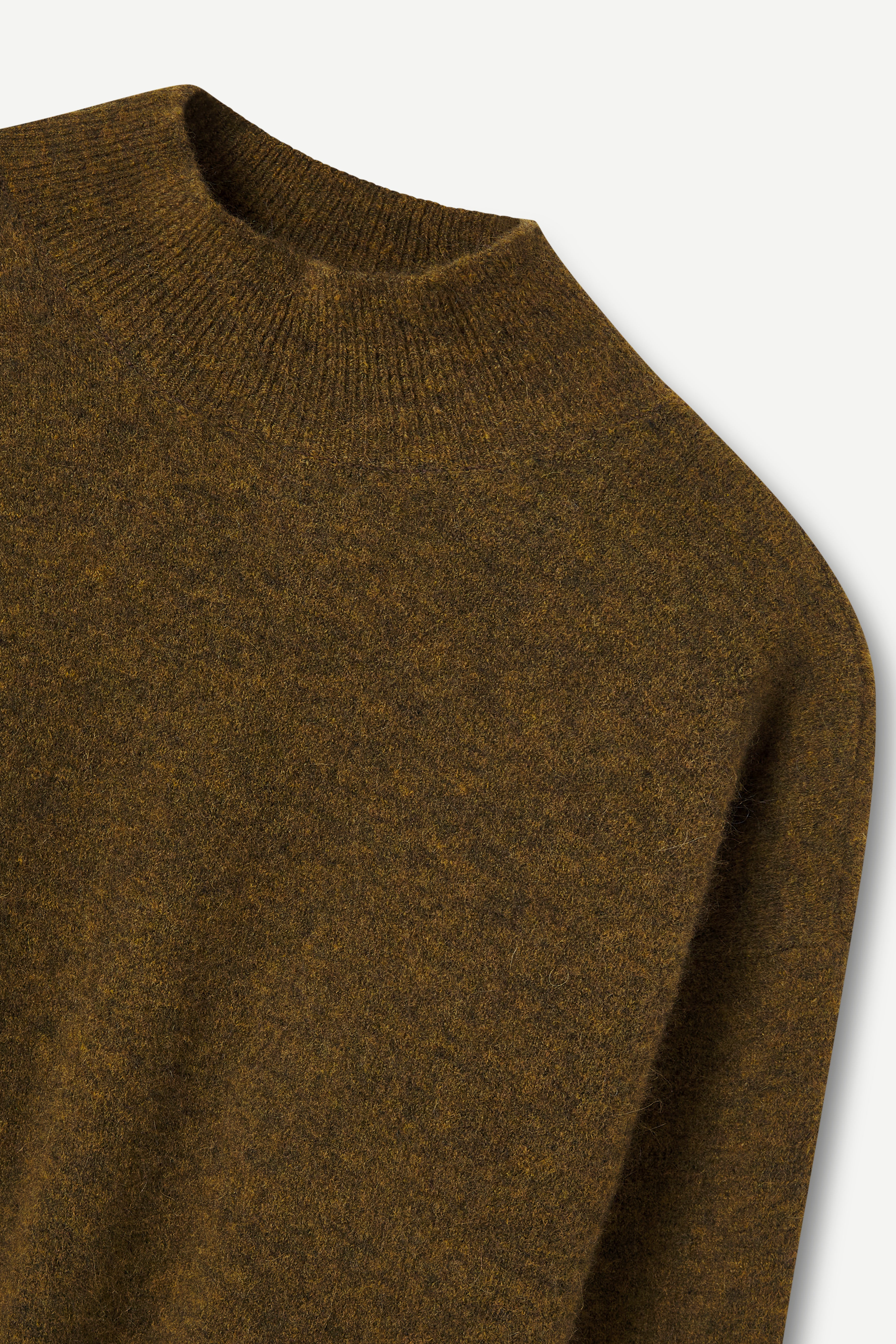 Olive knitted sweater on a light gray background