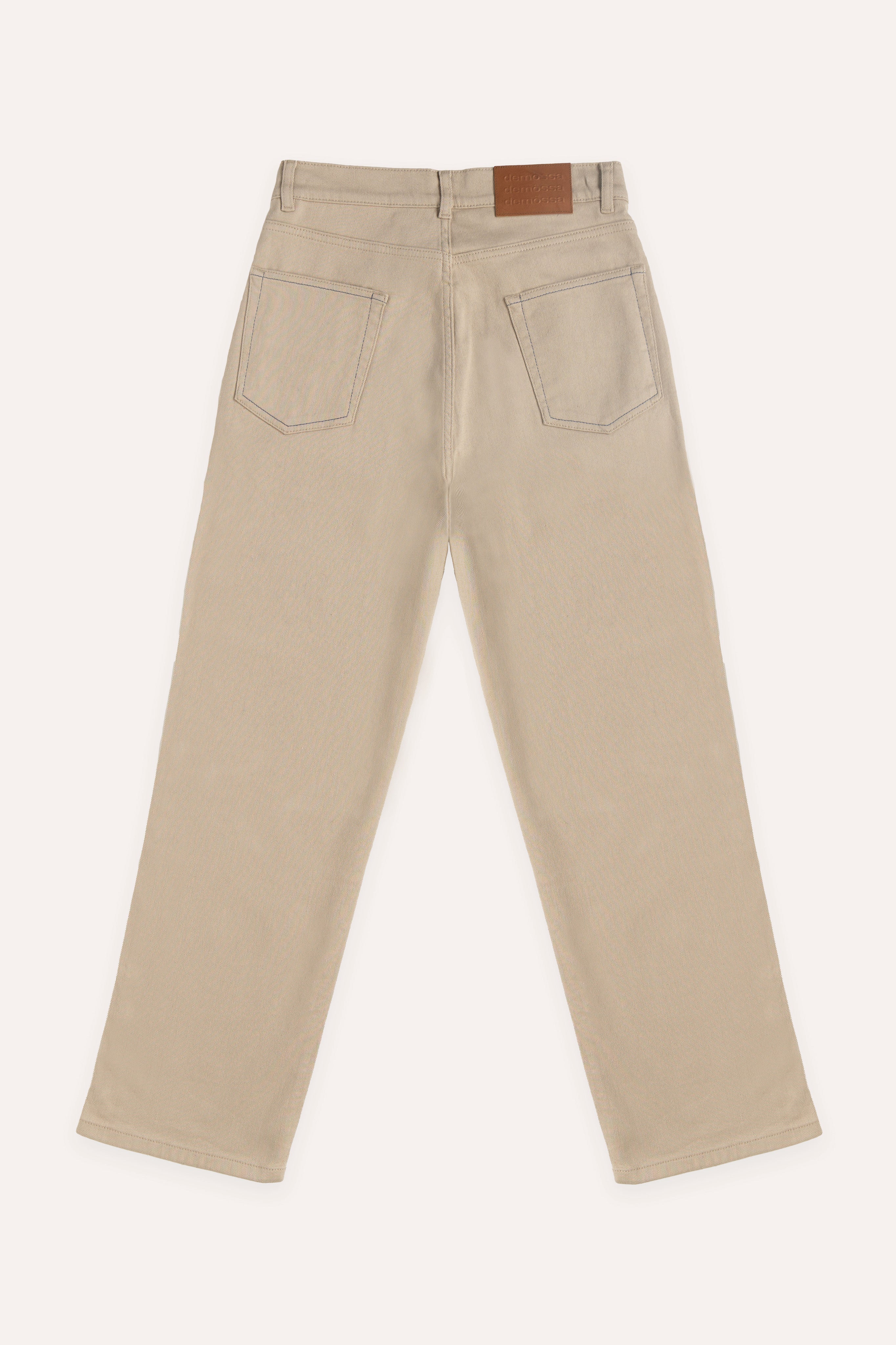 Flat lay back view of beige jeans showing rear patch pockets and clean waistband design