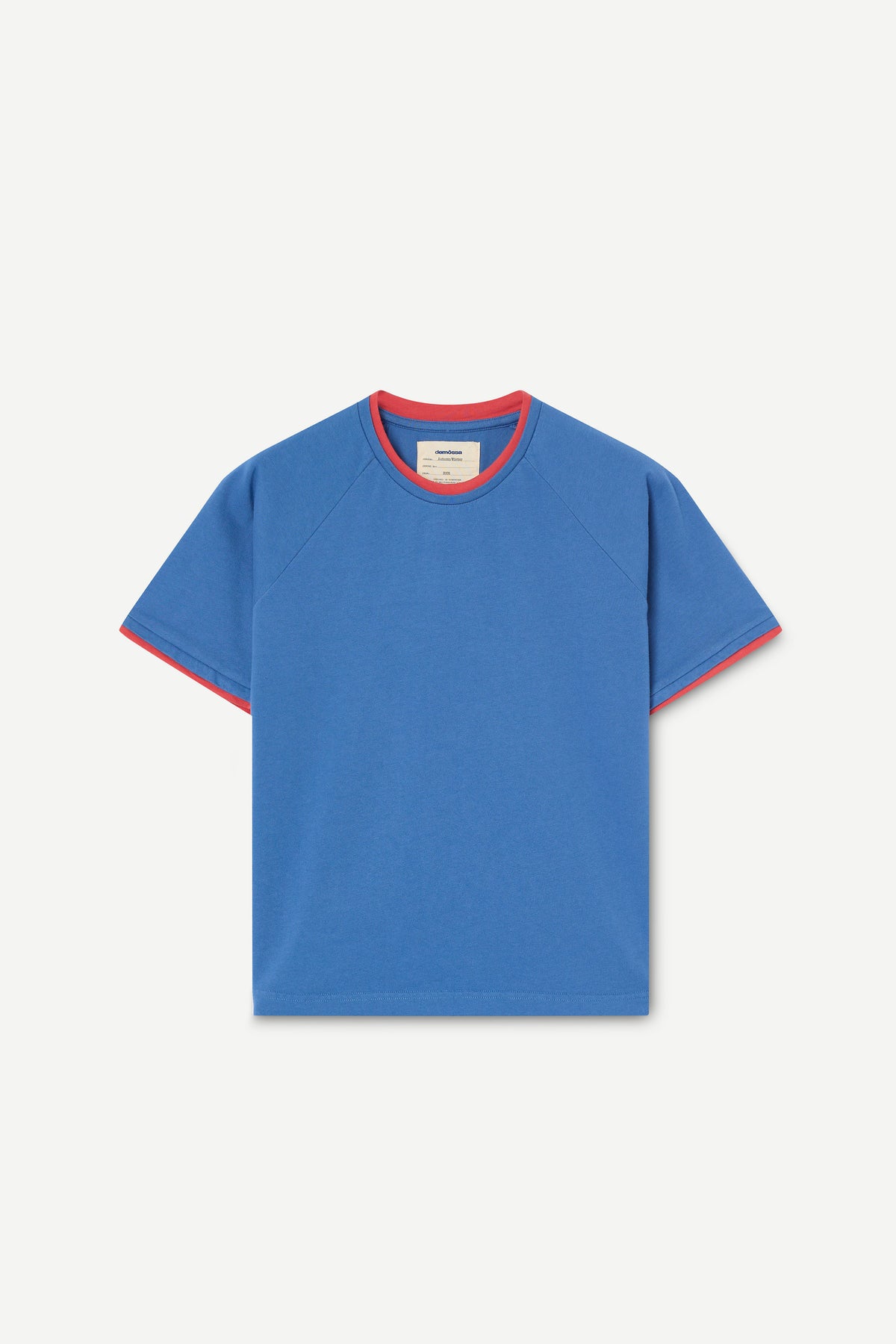 A blue short-sleeve raglan t-shirt with contrasting red trim on the crew neck and sleeve cuffs, displayed flat against a light off-white background.