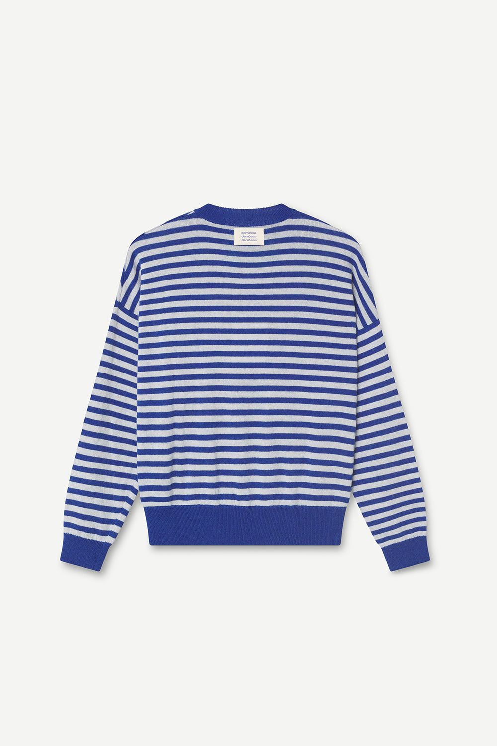 Blue and white striped sweater with a brand label on a light gray background
