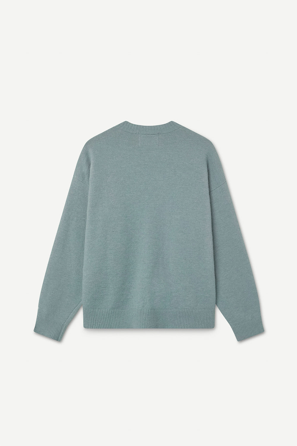 Turquoise sweater on a white background