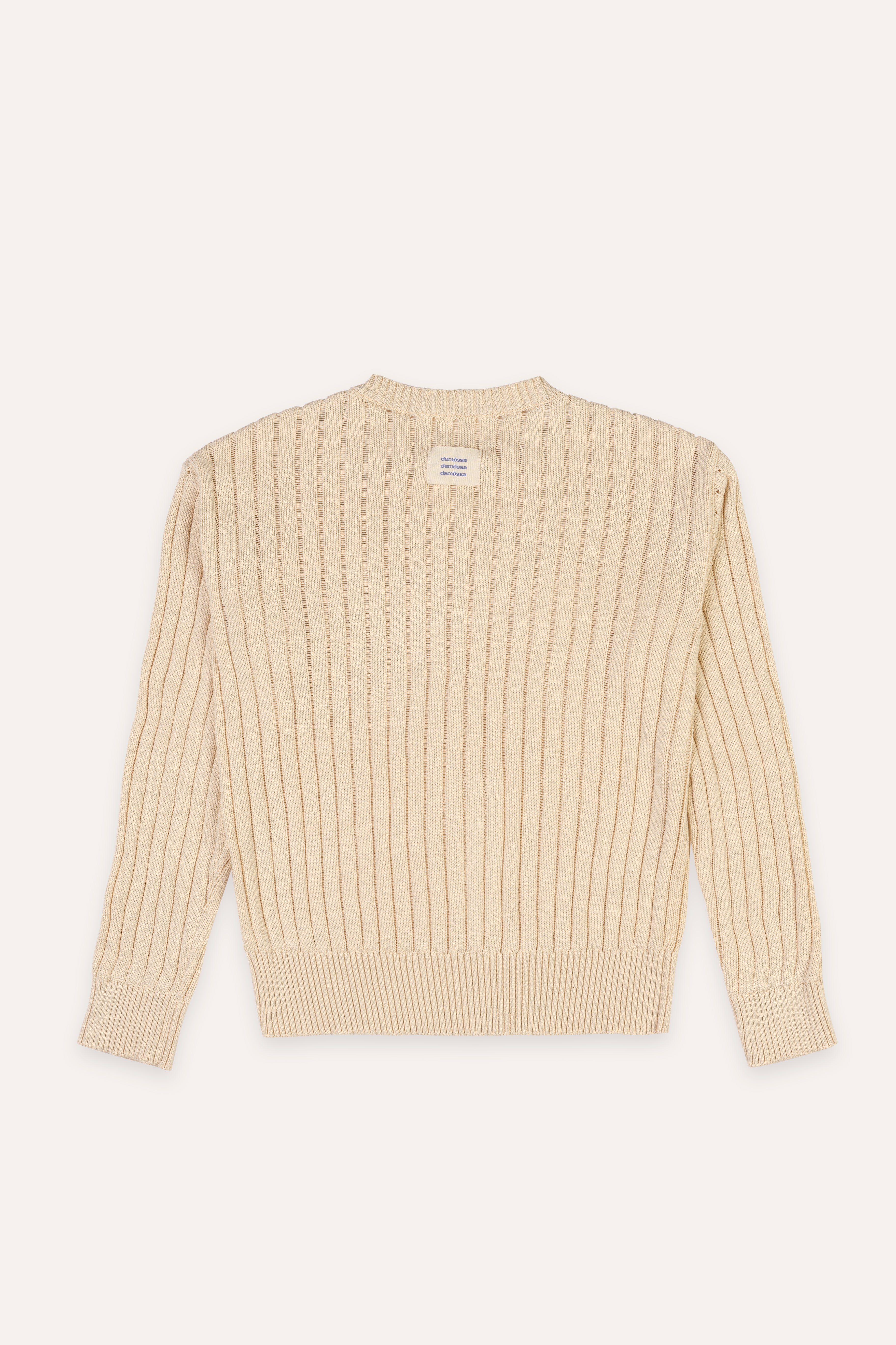 Beige ribbed sweater on a white background