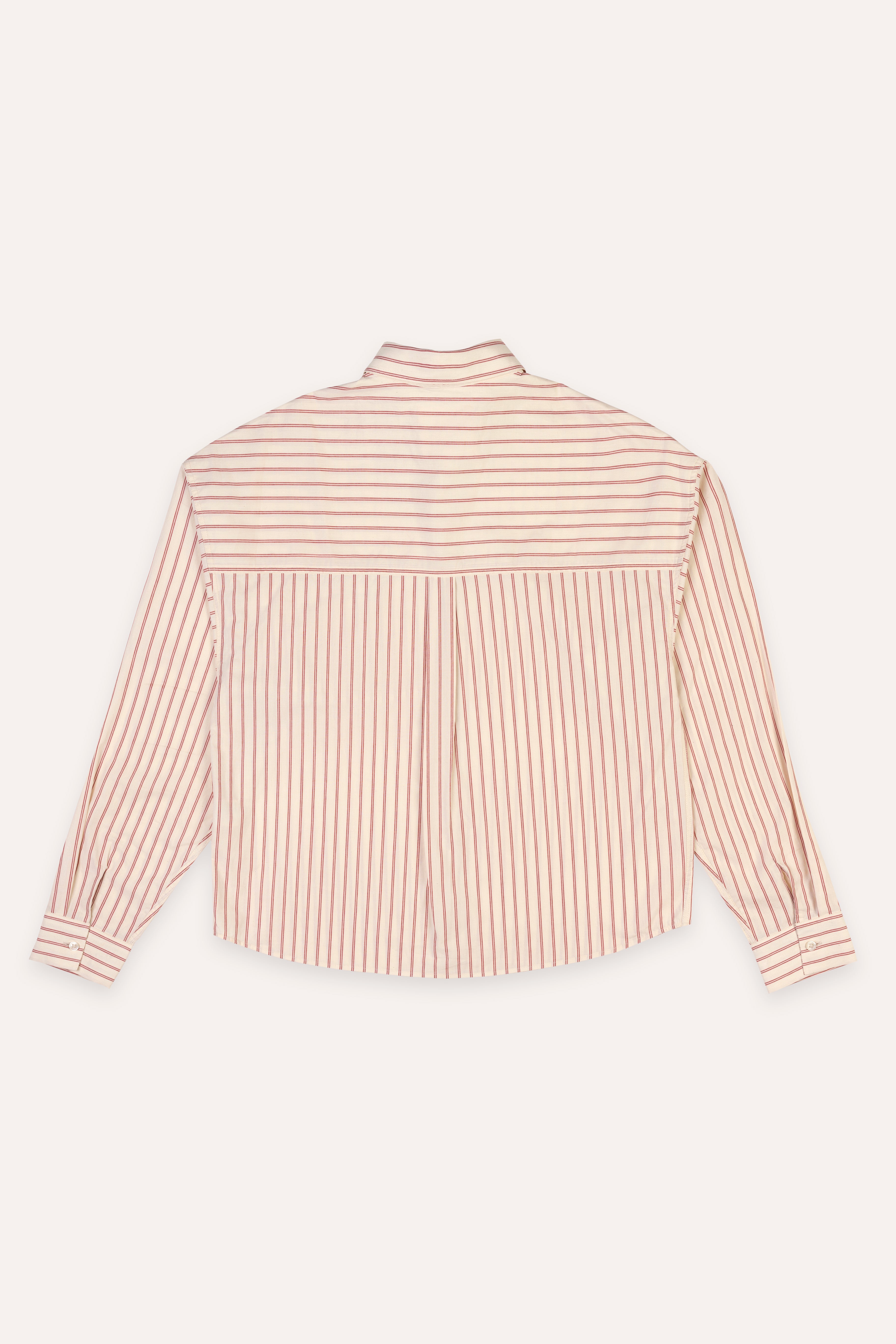 Pink and white striped shirt on a light pink background