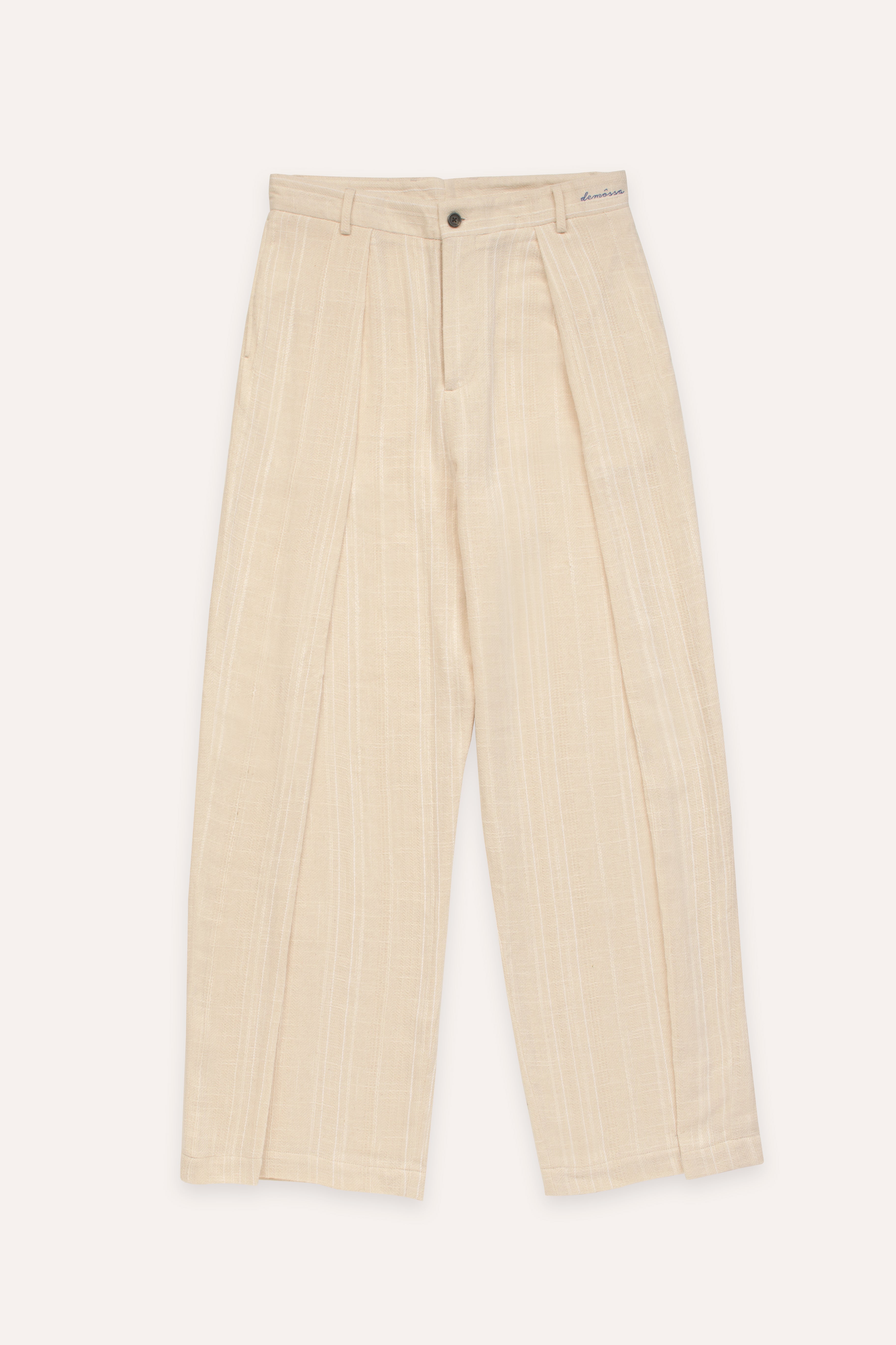 Cream cotton pleated pants on a white background