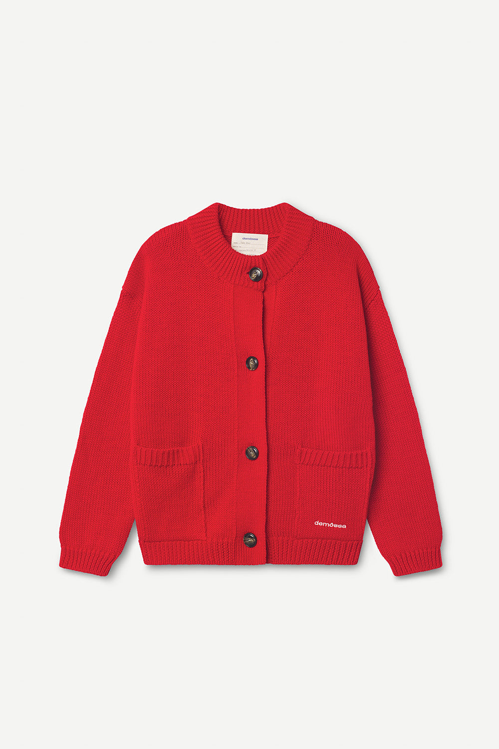 Red cardigan with black buttons and two front pockets on a light gray background