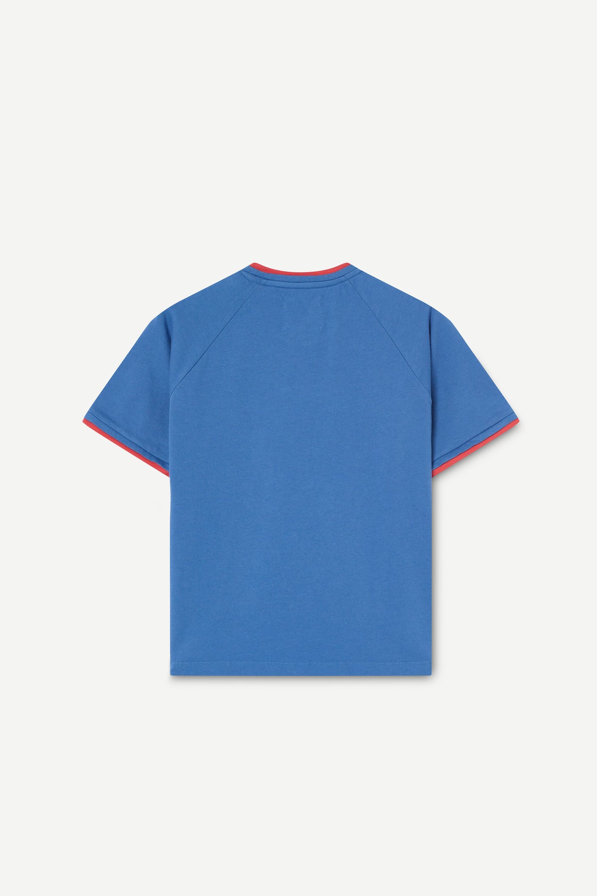 A blue short-sleeve raglan T-shirt shown from the back, featuring red contrast trim along the collar and sleeve cuffs, set against a light gray background.