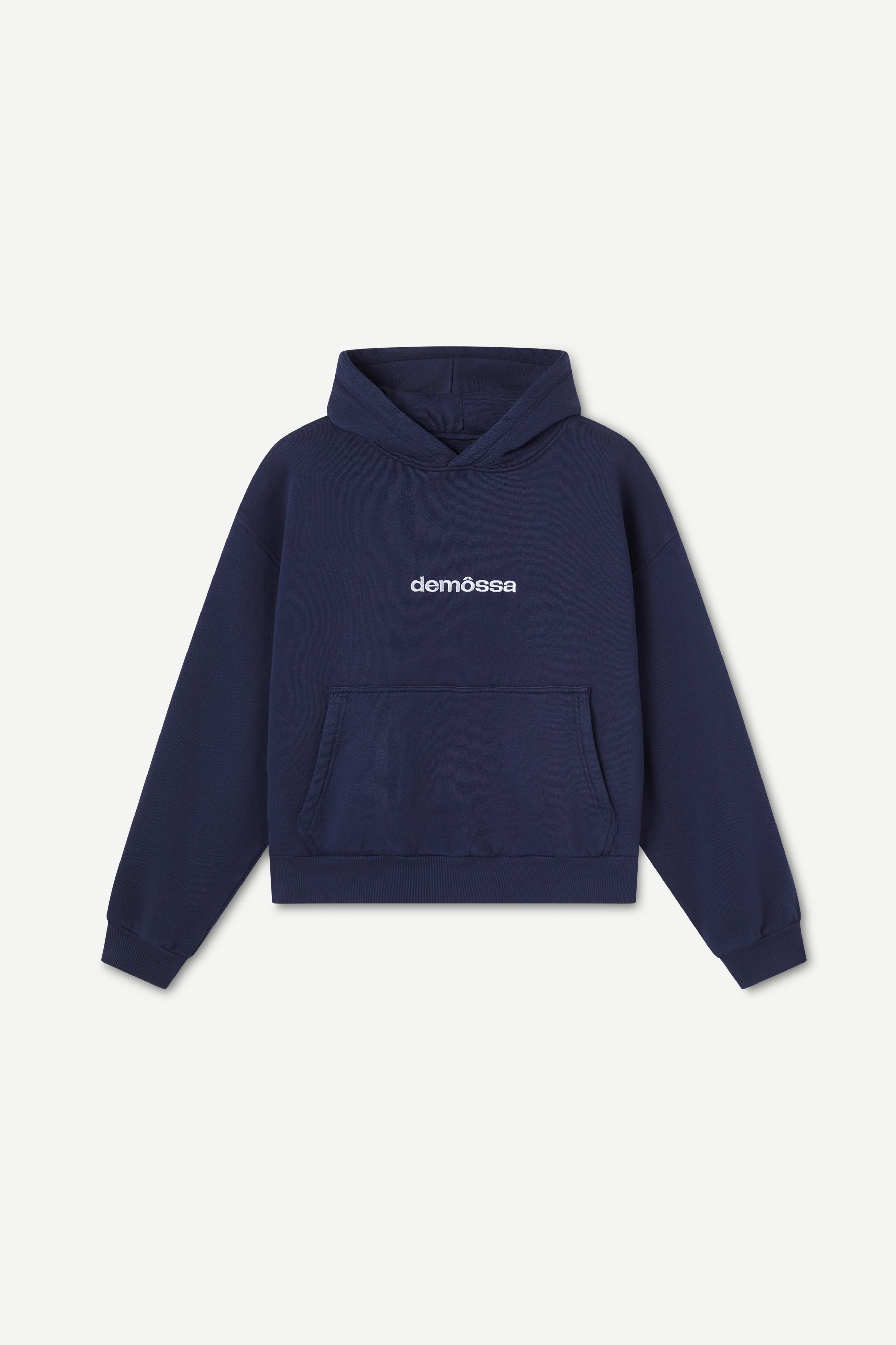 Navy blue hoodie with 'demôssa' branding on a light gray background