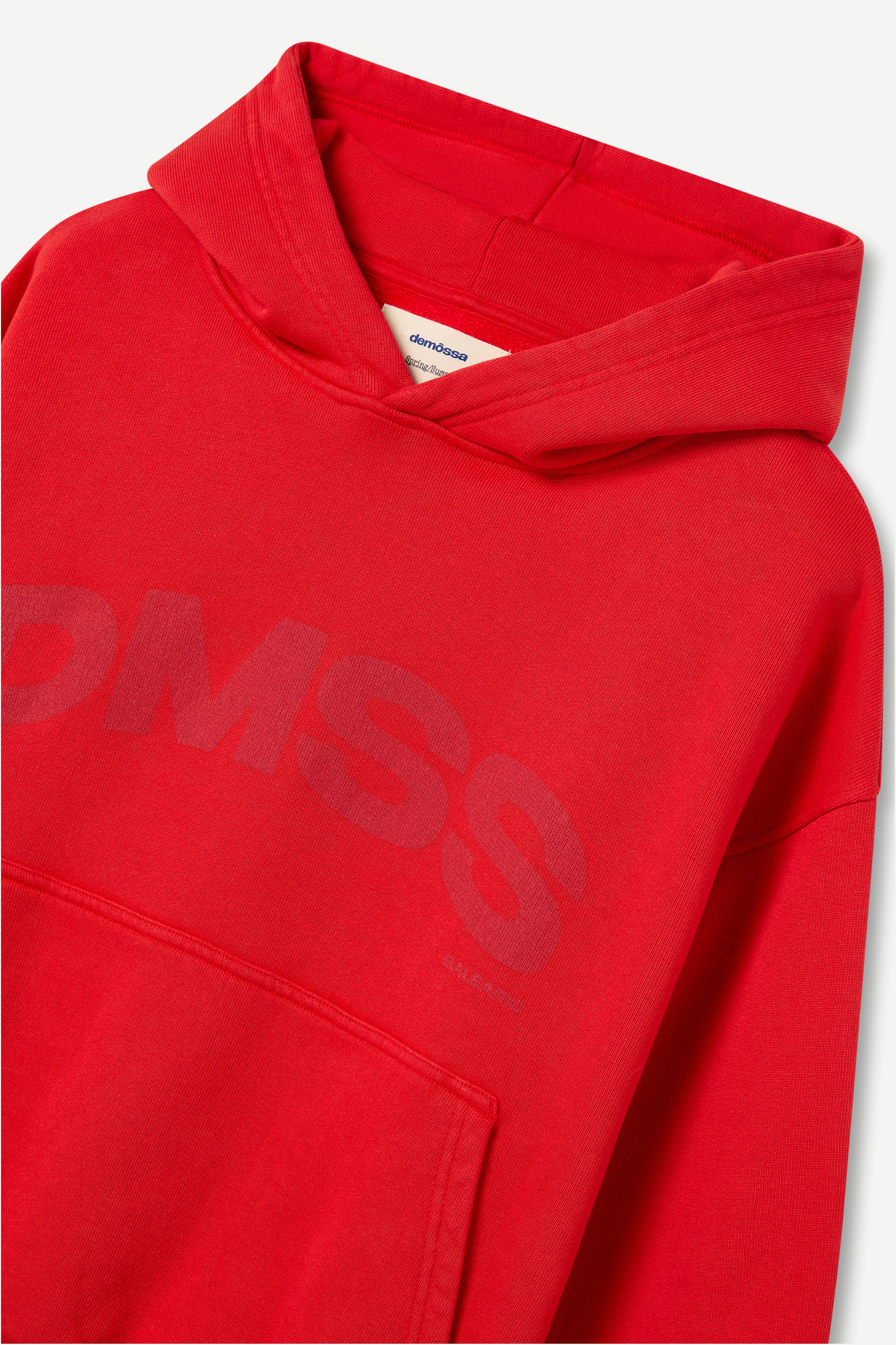 Red hoodie with 'DMSS' branding on a light gray background