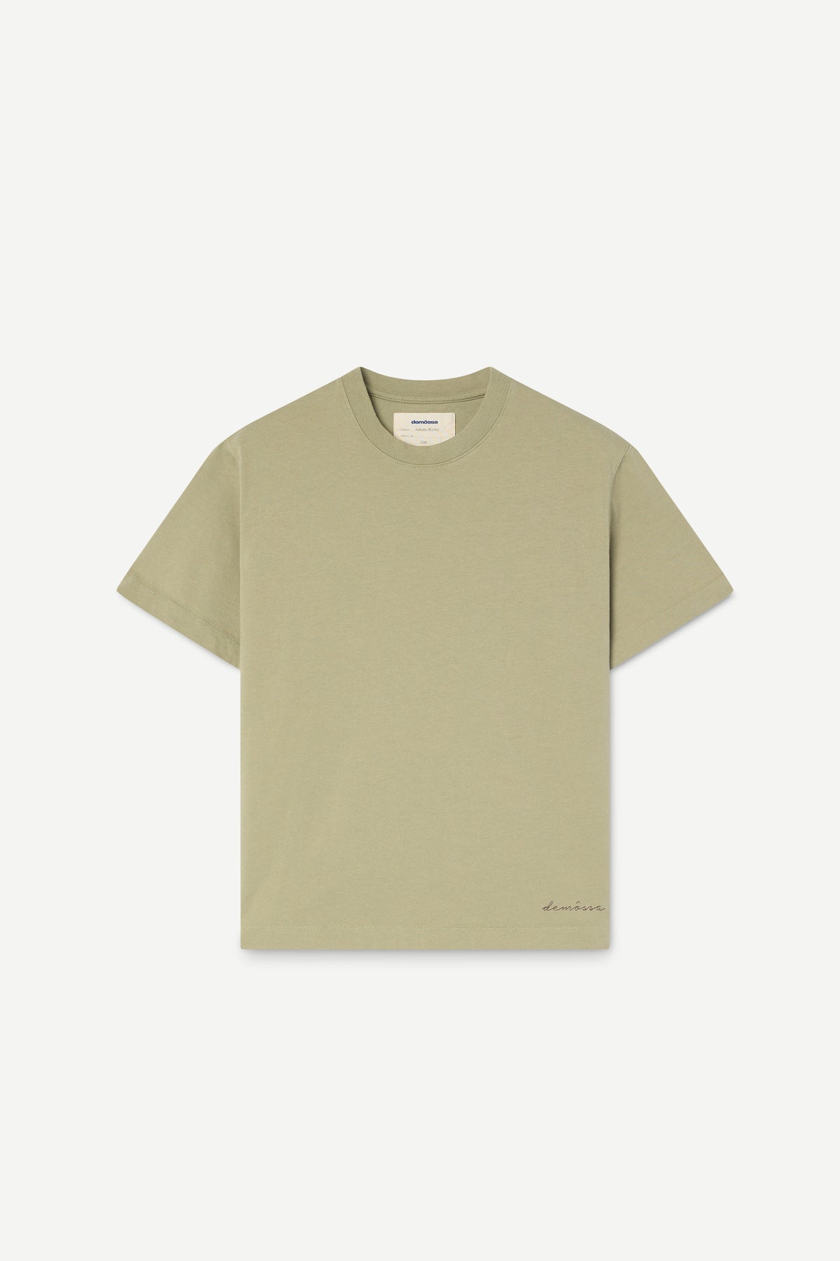 A light sage green short-sleeve t-shirt with a small embroidered logo on the bottom right hem, displayed flat against a light gray background.