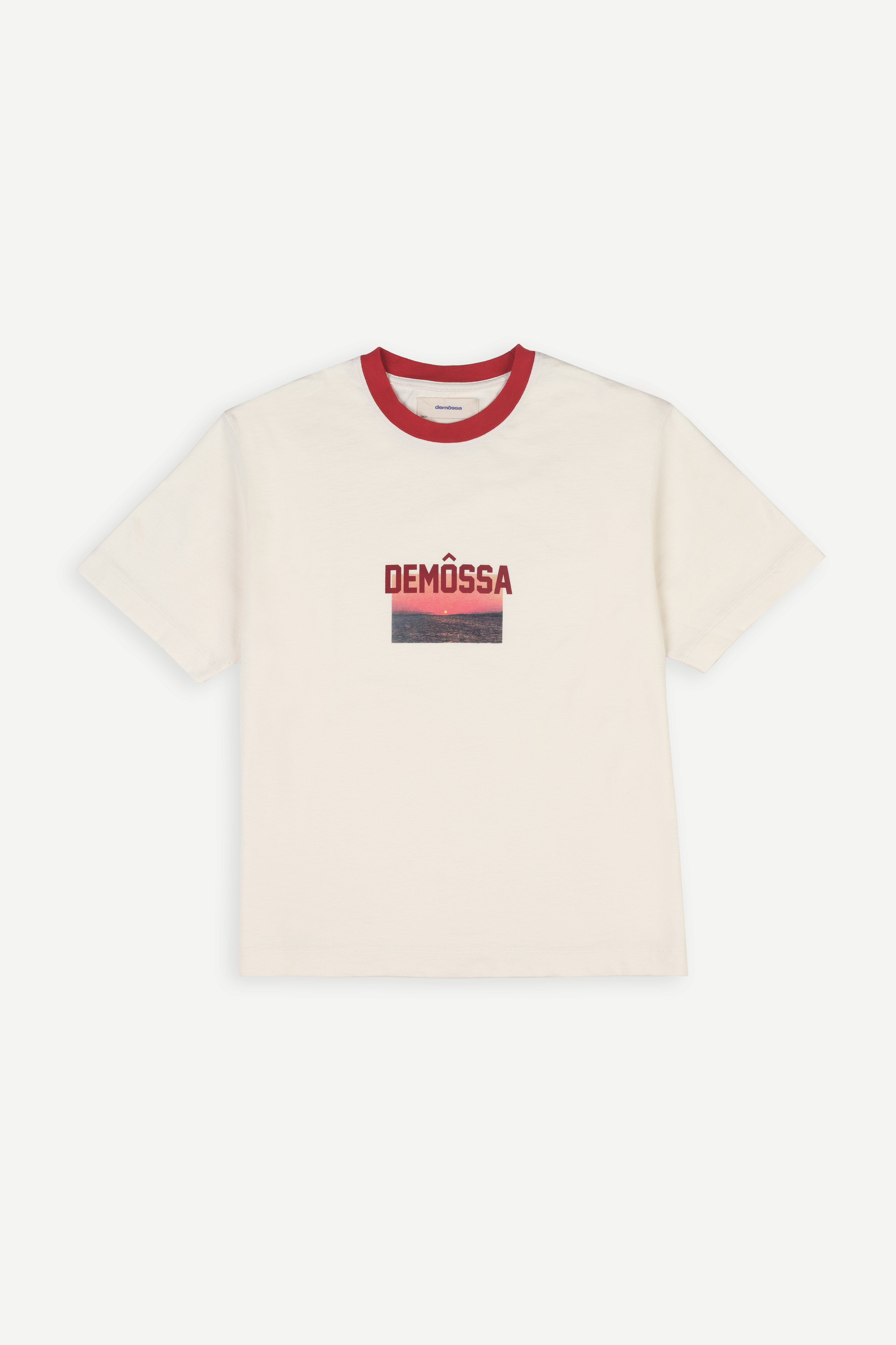 Beige t-shirt with red neckline and 'DEMOSSA' logo on a white background