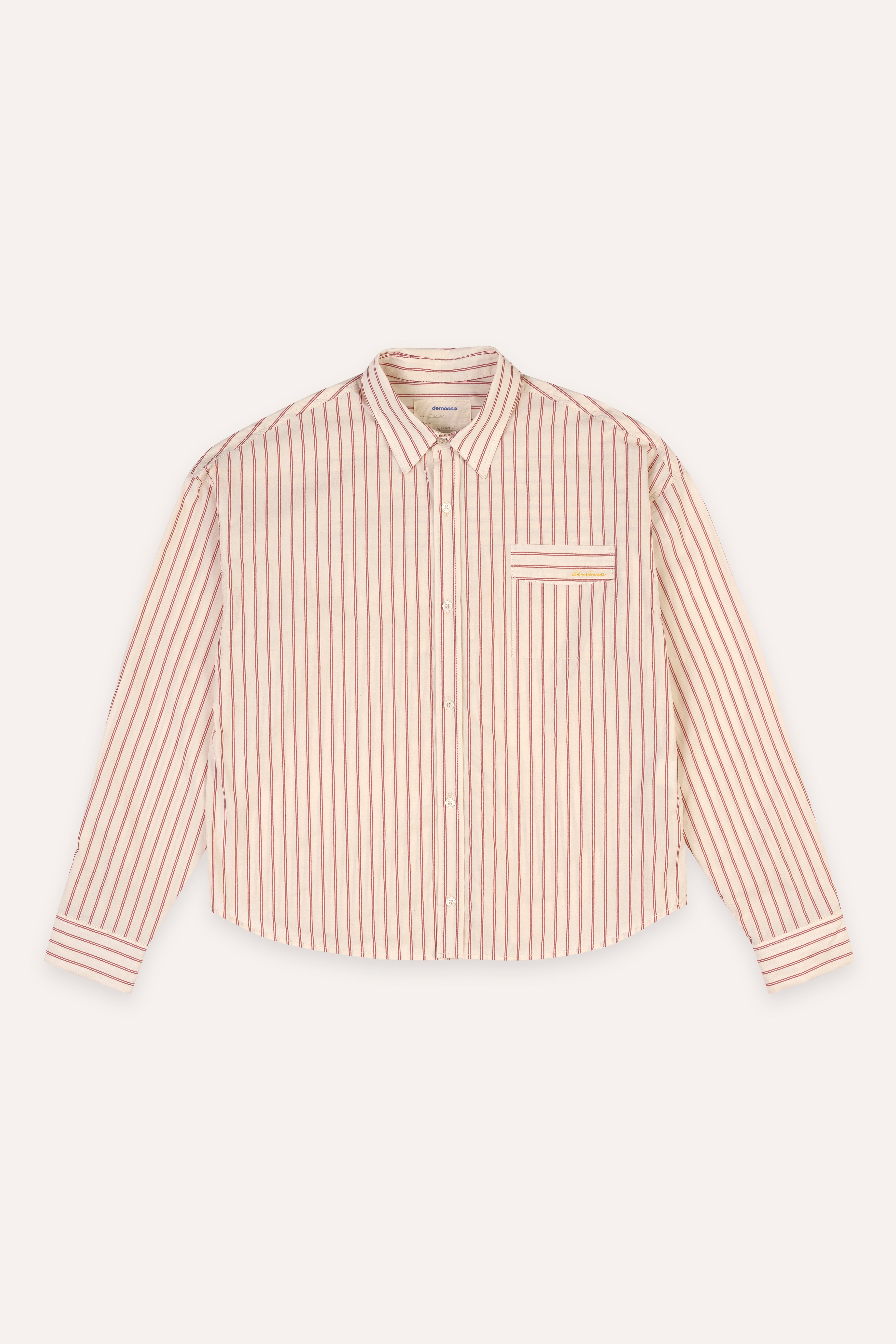 Pink and white striped shirt on a beige background