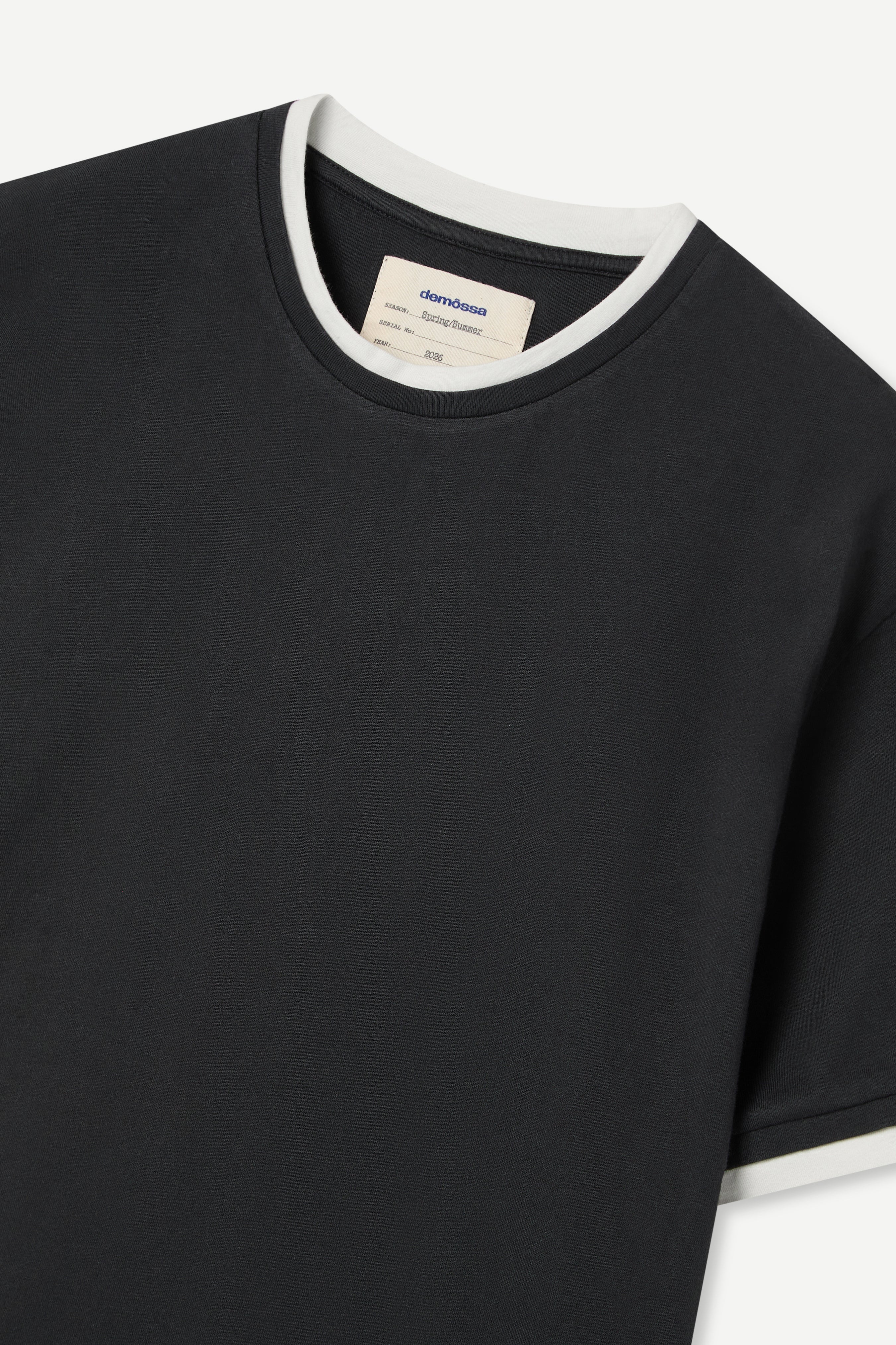 front view of a regular fit black short-sleeved t-shirt with white double-layered neckline, sleeves and hem