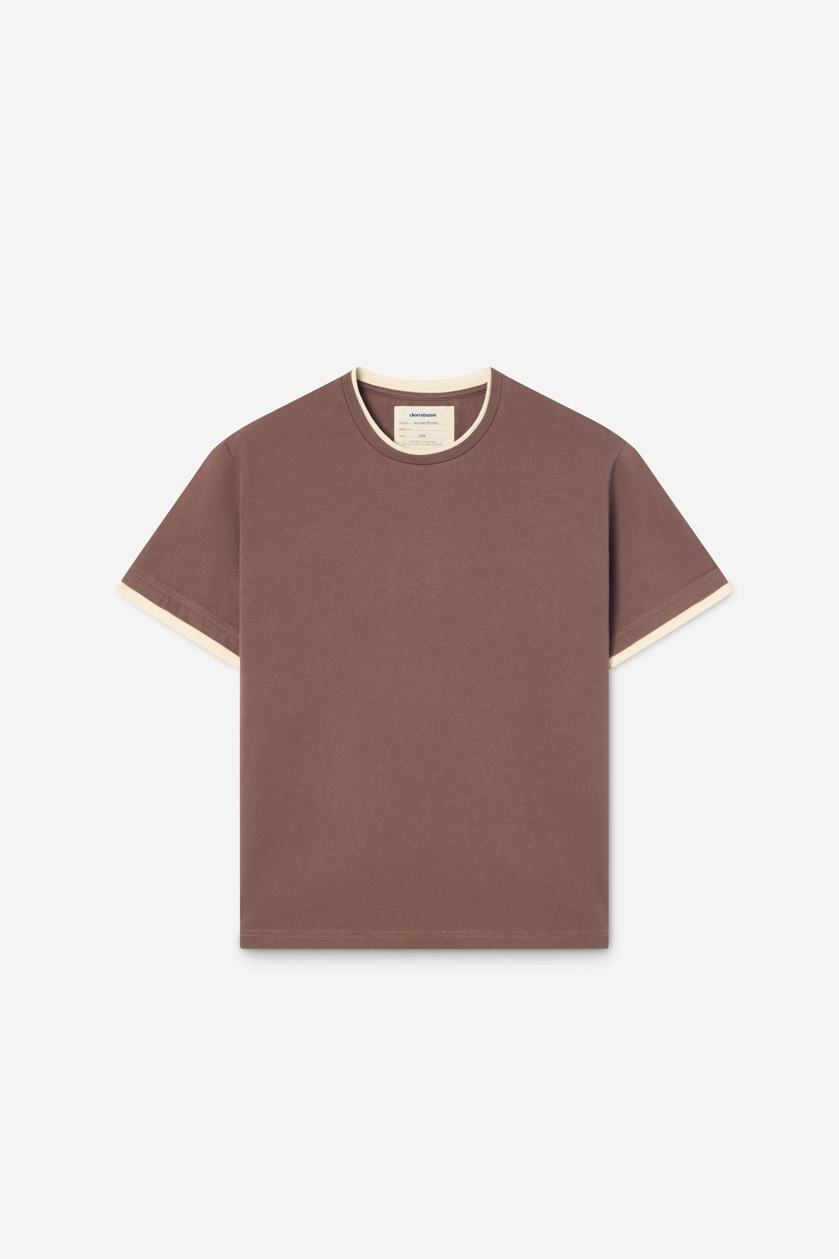 A short-sleeve crewneck t-shirt in a muted brownish-rose color with contrasting cream-colored trim along the collar and sleeve cuffs, displayed flat against a light off-white background.