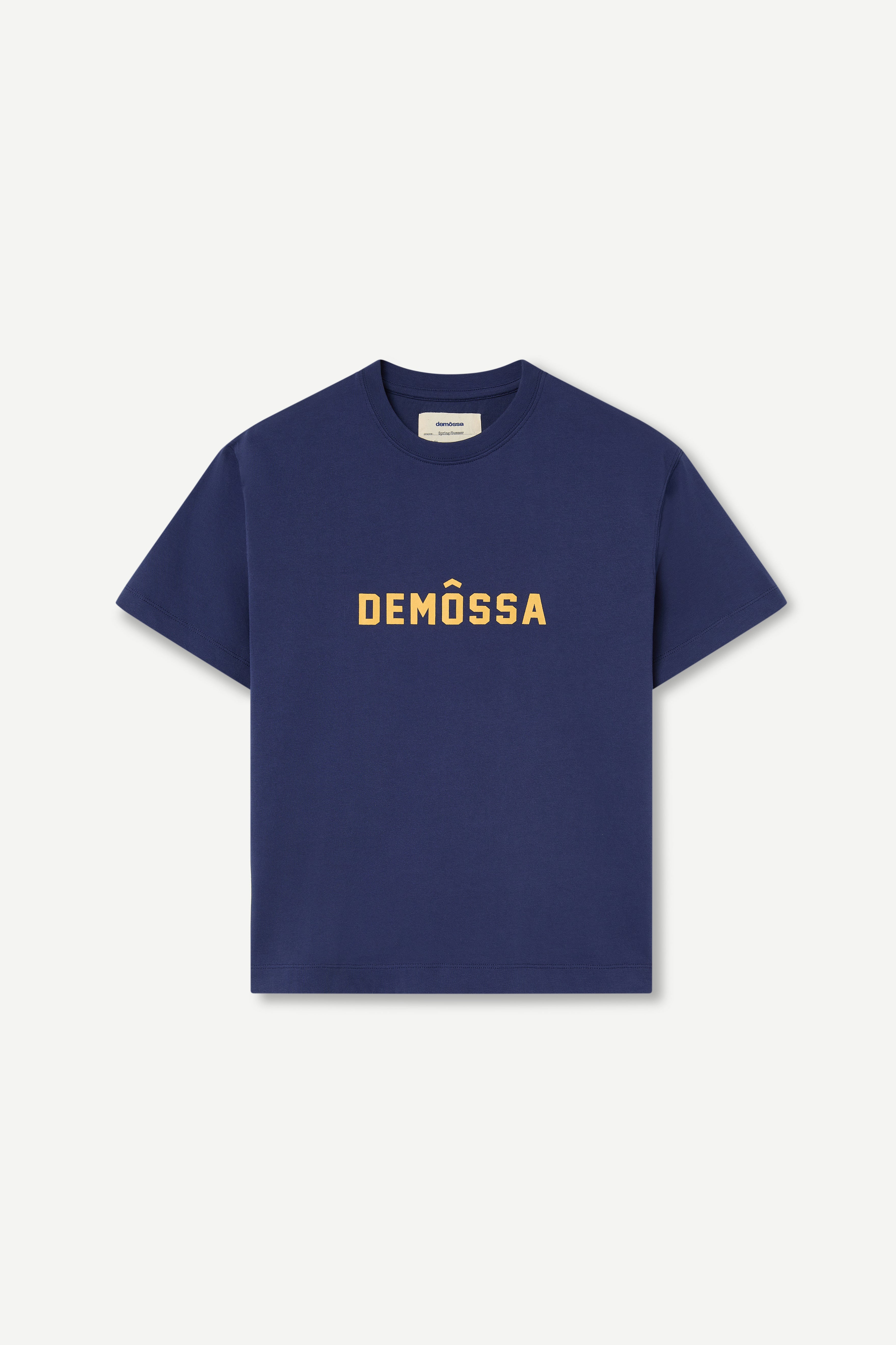 Navy blue t-shirt with 'DEMOSSA' text on a light gray background