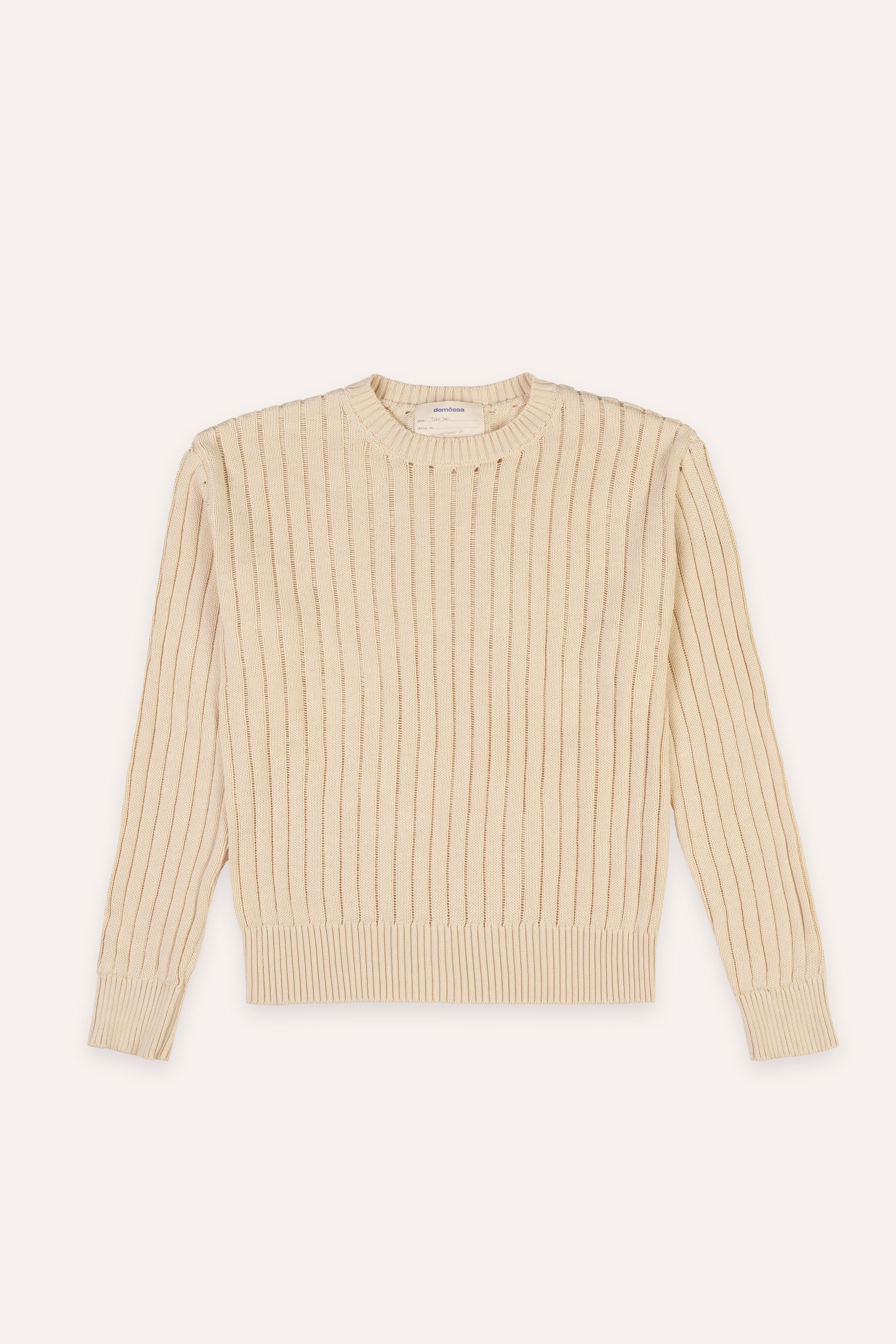 Beige ribbed sweater on a light beige background